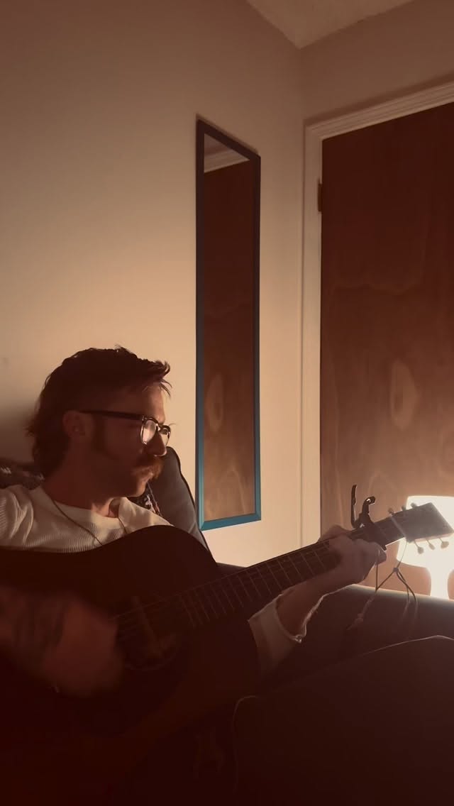 Clayton recording an acoustic cover