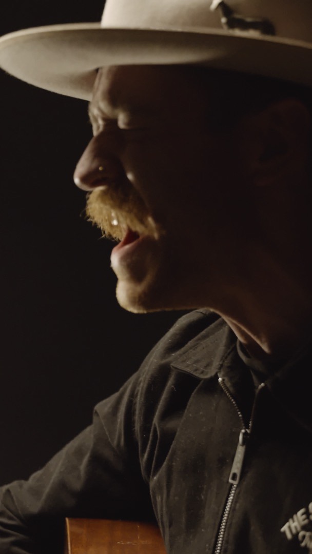 Trappers Pass singer close-up in warm shadow